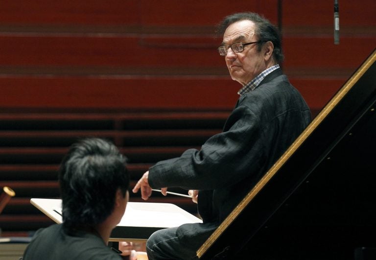 In 2011, world-renowned conductor Charles Dutoit performs with the Philadelphia Orchestra during a rehearsal in Philadelphia. Four women have accused Dutoit of sexual misconduct that allegedly occurred on the sidelines of rehearsals or performances with some of America's great orchestras. The 81-year-old is the artistic director and principal conductor at London's Royal Philharmonic Orchestra and conductor laureate of the Philadelphia Orchestra.   (AP Photo/Alex Brandon, File)