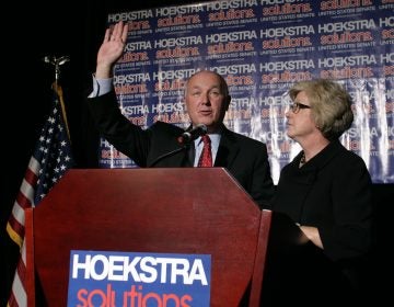 Republican U.S. Senate candidate Pete Hoekstra greets supporters before giving a concession speech as his wife Diane, right, stands by, Tuesday, Nov. 6, 2012, in Grand Rapids, Mich.