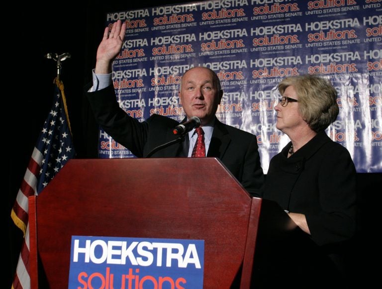 Republican U.S. Senate candidate Pete Hoekstra greets supporters before giving a concession speech as his wife Diane, right, stands by, Tuesday, Nov. 6, 2012, in Grand Rapids, Mich.