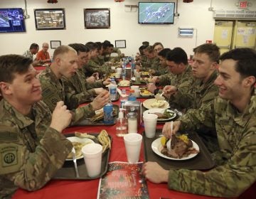 Members of the U.S. military eat Christmas dinner at the Resolute Support Headquarters in Kabul, Afghanistan, Monday, Dec. 25, 2017. (Rahmat Gul/AP Photo)