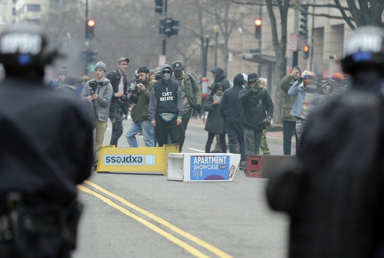 In this Jan. 20, 2017, file photo, protesters face off with police in downtown Washington. A jury has acquitted six people on multiple charges of rioting and destruction of property connected to violent protests during President Donald trump’s Jan. 20 inauguration. (Mark Tenally/AP, file)