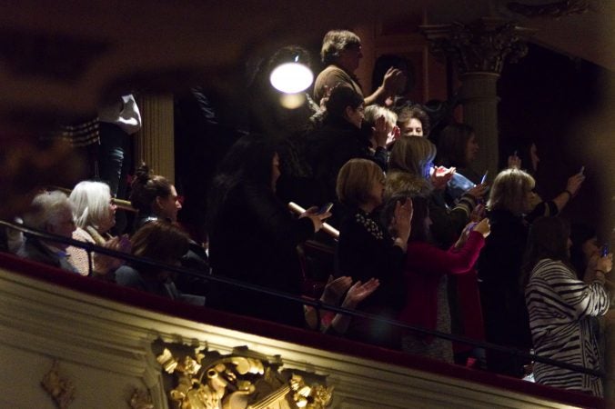 Fans in the balcony seats applaud as Hillary Clinton takes the stage during a book tour stop at the Academy of Music, on Thursday in Philadelphia. (Bastiaan Slabbers for WHYY)