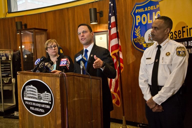 Pennsylvania Attorney General Josh Shapiro (center), Shira Goodman, CeaseFire PA executive director, (left) and Philadelphia Police Commissioner Richard Ross (right) held a press conference at police headquarters Tuesday to express concern over concealed carry reciprocity. (Kimberly Paynter/WHYY)