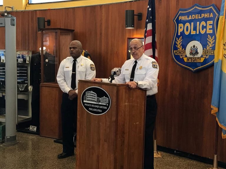 First Deputy Commissioner Myron Patterson, at podium, and Capt. Sekou Kinebrew, a police spokesman, talk to reporters Thursday at Philadelphia police headquarters about a deadly police-involved shooting in Ogontz. (Dana DiFilippo/WHYY)