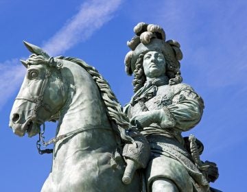 An equestrian statue of France's Louis XIV is shown at the palace at Versailles.
