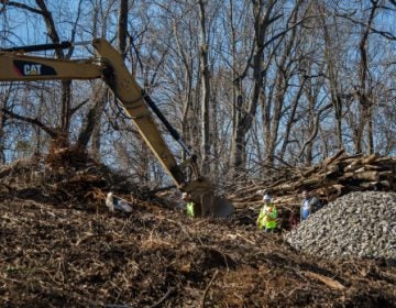 A backhoe clears land for construction of the Mariner East 2 pipeline in Delaware County in early 2017. (Emily Cohen)