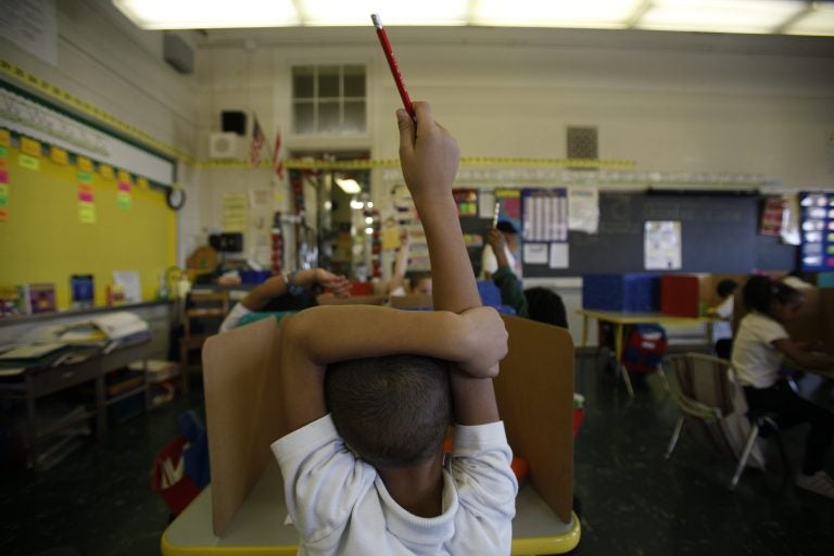 A student raises his hand at Isaac Sheppard School in Philadelphia, Pennsylvania