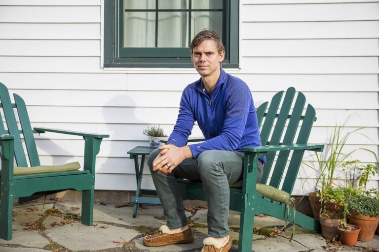 Matt Rooke sits outside of his home in State College, Pennsylvania. A former resident at the Hilltop Mobile Home Park, Rooke said his experience of being displaced gave him insights of the affordable housing problem in the area. (Min Xian/Keystone Crossroads)