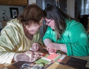 Joann Clark, left, and her daughter, Jessica Clark, 35, lean to touch their foreheads as they share a funny moment talking about Jessicaís love of Bette Midler as they talk at the kithcen table in their Glen Mill, PA home.   Joann Clark is 69 years old and her daughter, Jessica Clark, 35, lives with her in her over 55 community in Glen Mills, PA  Joann Clark is worried about what will happen to her daughter after she is gone.   MICHAEL BRYANT / Staff Photographer