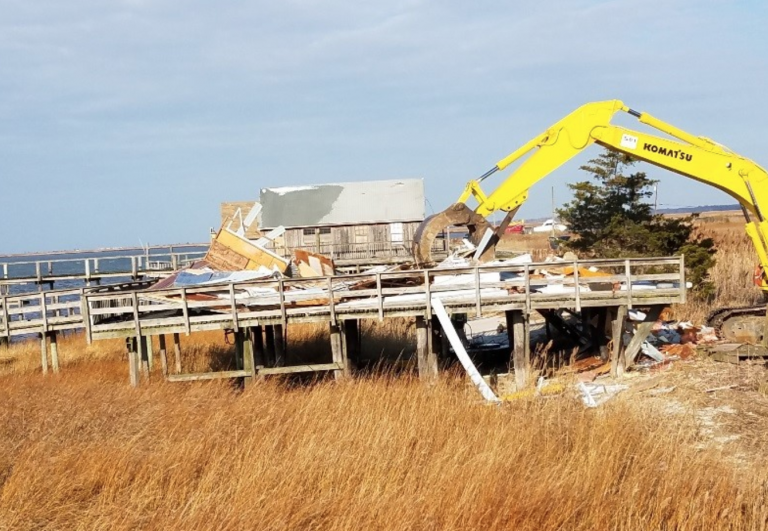 Heavy machinery is used to demolish a house along the Delaware Bay in Lawrence Township. (Image: New Jersey Department of Environmental Protection)