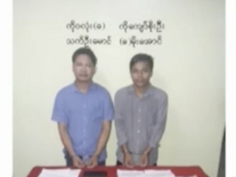 Reuters reporters Wa Lone, left, and Kyaw Soe Oo stand handcuffed in an image released by the Myanmar Ministry of Information and broadcast by MRTV on Dec. 13. (AP) 