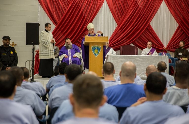 Philadelphia Archbishop Charles Chaput speaks to inmates at the Curran-Fromhold Correctional Center during an annual Christmas Mass at the prison on Dec. 18, 2017. (Lindsay Lazarski/WHYY)