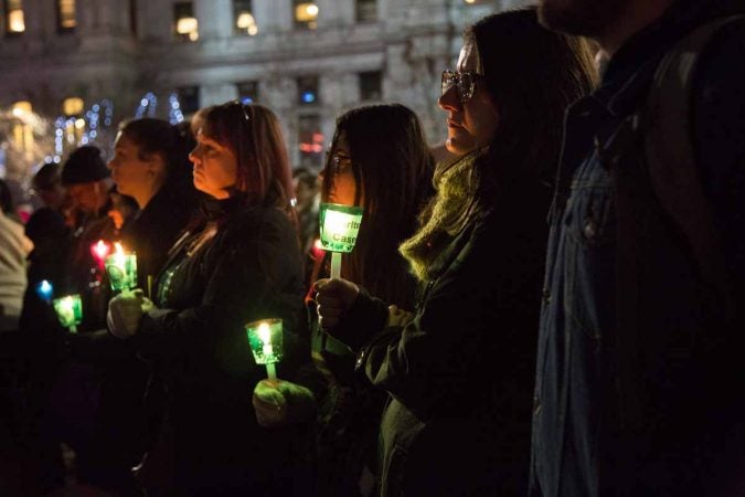 Hundreds of Philadelphians gather at Thomas Paine Plaza to remember the those who died on the streets in 2017 and those who used to be homeless who died. (Emily Cohen for WHYY)