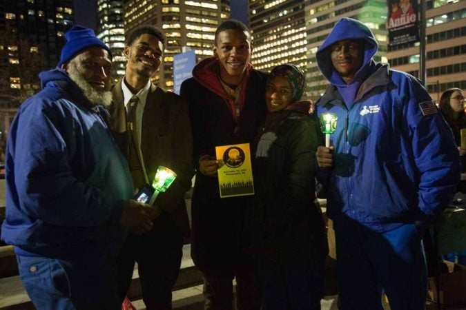 All currently or formerly homeless, Arturo Simmons, 52, Jonathan Cooper, 22, Edward Pollard, 22, Tori Stoddart, and Lewis Barrett, 22, (Left to Right) stand together at the 2017 Homeless Memorial to mourn and honor those in their community who lost their lives this year and raise awareness. (Emily Cohen for WHYY)