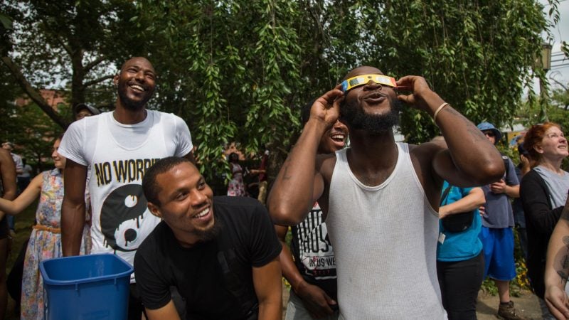 Shakur Montgomery, 29, of North Philadelphia stops in at the Wagner Free Institute of Science in North Philadelphia to view and learn about the 2017 partial eclipse of the sun on Monday August 21, 2017. (Emily Cohen for NewsWorks)