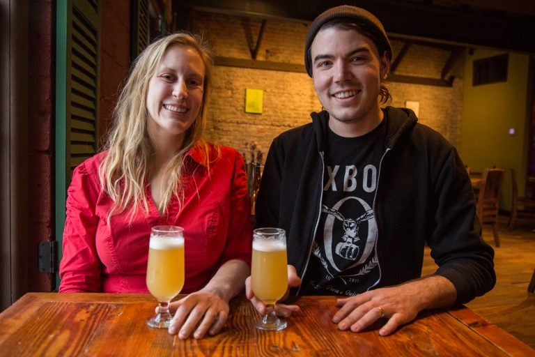 Julie Foster and Jean Broillet IV chat about beer trends at the cafe at their Tired Hands Brewery in Ardmore, Pennsylvania. (Emily Cohen for WHYY)