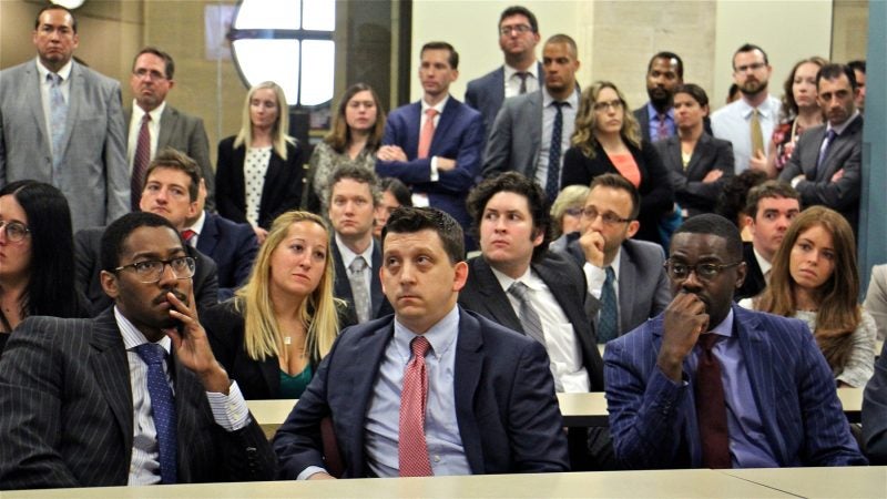 Employees of the Philadelphia District Attorney's Office gather to hear about Seth Williams' resignation and his mid-trial guilty plea to corruption charges. (Emma Lee/WHYY)