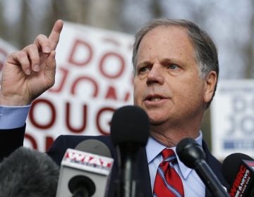 Democratic candidate for U.S. Senate Doug Jones speaks to reporters after casting his ballot Tuesday, Dec. 12, 2017, in Mountain Brook , Ala.  Jones is facing Republican Roy Moore. (AP Photo/John Bazemore)