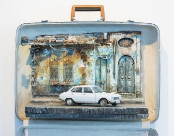 The white Peugeot 405, the vehicle of choice for the Syrian secret police, is parked outside a home in Damascus. In the diorama's upper left corner hangs a camera, suggesting surveillance.
(Rodney Nelson)