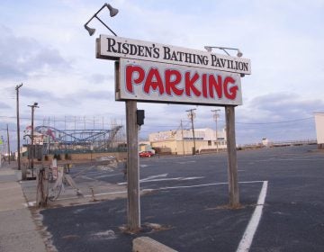 This Dec. 4, 2017 photo shows a sign at the entrance to Risden's Beach in Point Pleasant Beach, N.J. The owners of the privately owned beach are fighting New Jersey's effort to build protective sand dunes there, alleging the state's real motive is to seize their business. The state denies any such intention. (AP Photo/Wayne Parry)