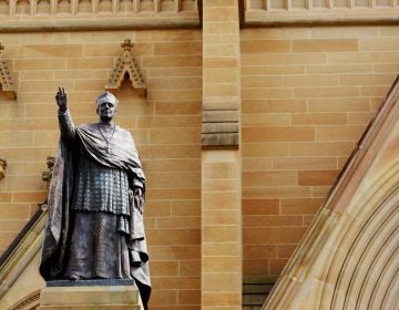 The bronze statue of Cardinal Moran stands by the entrance of St. Mary's Cathedral, in Sydney, Australia. (Nina Dermawan#145440/Moment Editorial/Getty Images) 