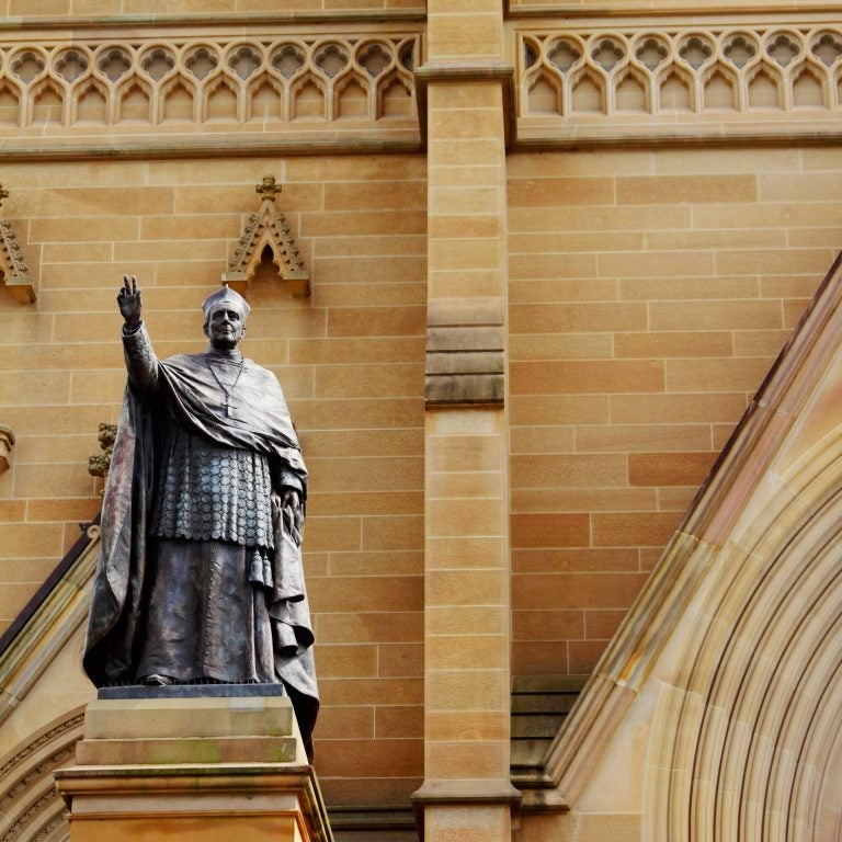 The bronze statue of Cardinal Moran stands by the entrance of St. Mary's Cathedral, in Sydney, Australia. (Nina Dermawan#145440/Moment Editorial/Getty Images) 