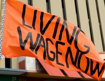 Protesters rally outside a restaurant in St. Louis on Feb. 13. The service industry employs the largest percentage of minimum wage workers. (Jeff Curry/Getty Images)