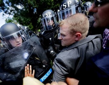 White nationalists clash with police as they are forced out of Emancipation Park after the 