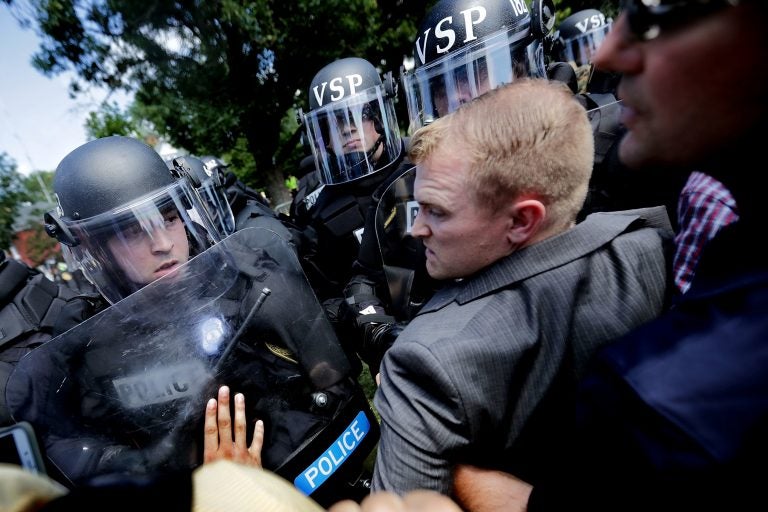 White nationalists clash with police as they are forced out of Emancipation Park after the 