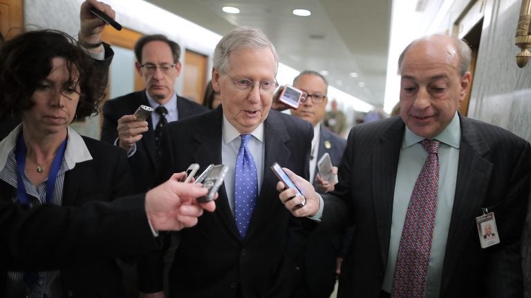 Senate Majority Leader Mitch McConnell (R-KY) talks with reporters after leaving a tax reform news conference in the Dirksen Senate Office Building on Capitol Hill.