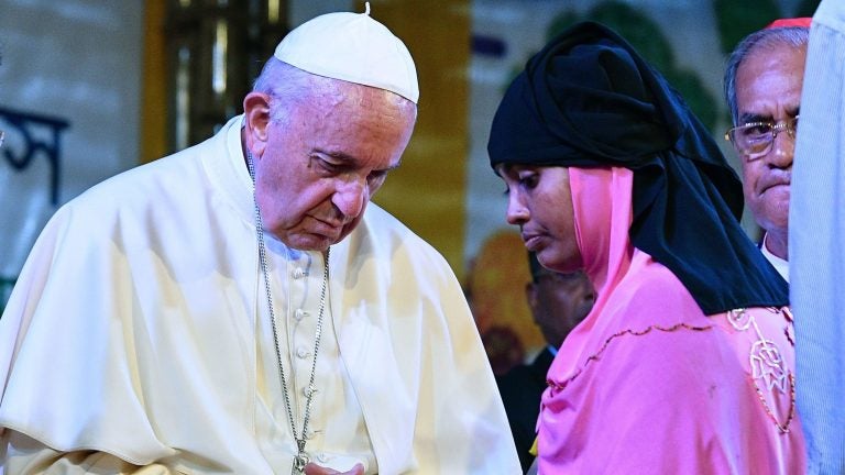 Pope Francis meets with a Rohingya refugee at the archbishop's residence in Dhaka. Pope Francis arrived in Bangladesh from Myanmar, the second stage of a visit that has been dominated by the plight of hundreds of thousands of Rohingya refugees. (Vincenzo Pinto/AFP/Getty Images)