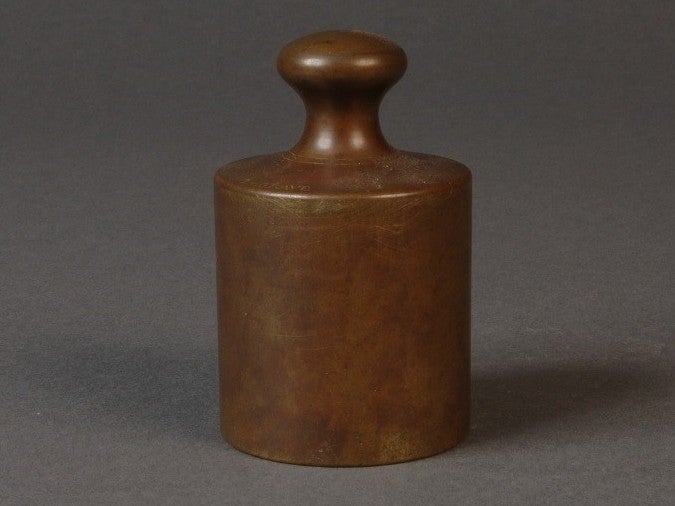 This 1793 grave is an early version of the kilogram. It is possible this object, now owned by the National Institute of Standards and Technology museum, was once pirate treasure. (NIST Museum)