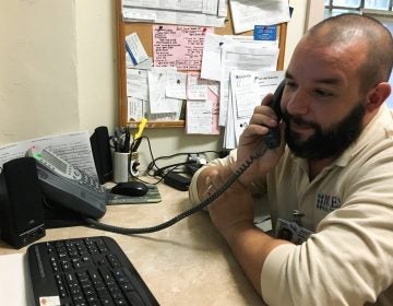 Paul Butler works at the 24-hour hotline at the main psychiatric hospital in Montgomery County, Pennsylvania. (Elana Gordon/WHYY)