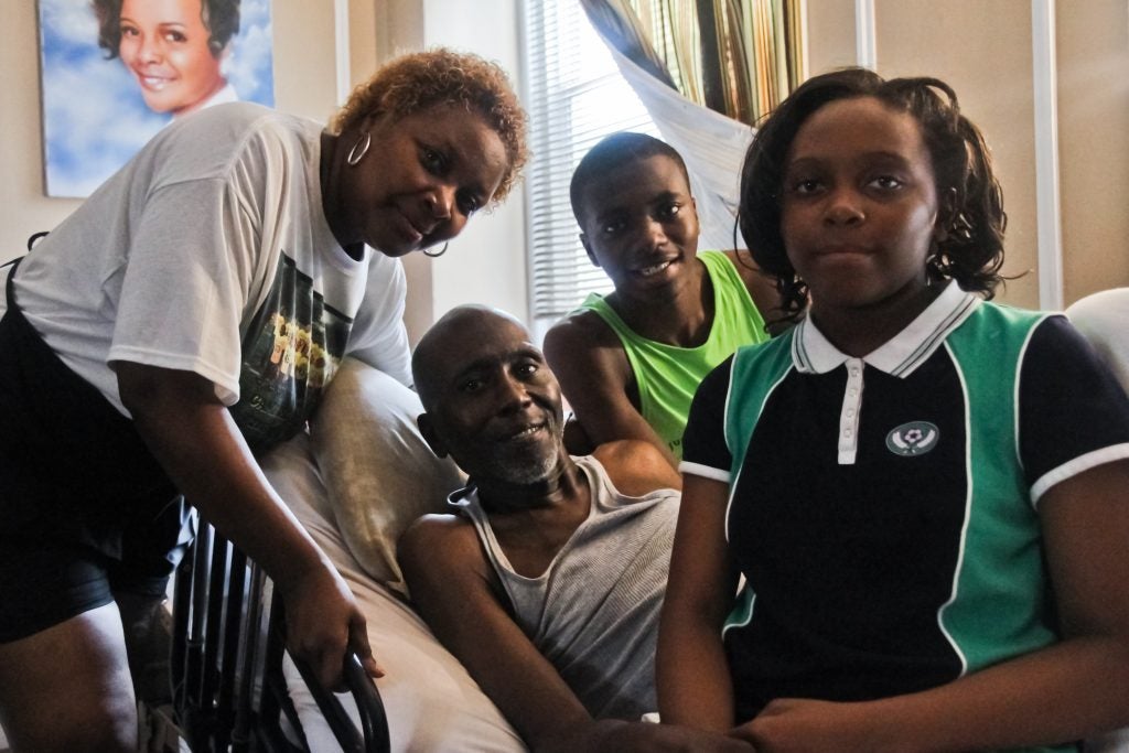 James Murphy rests in his home, surrounded by his family