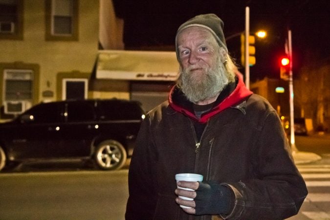 Dennis Payne, a formerly homeless activist, joined different organizations to sing holiday carols at 2nd and Indiana Streets in Kensington. (Kimberly Paynter/WHYY)