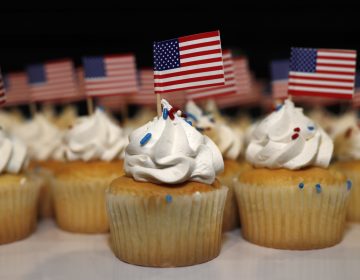 Cupcakes adorned with American flags sit on trays for supporters of Jack Phillips, owner of Masterpiece Cake