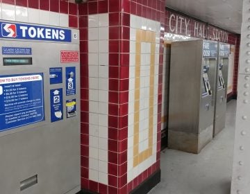 A SEPTA token machine (left) will eventually be taken out of service as the electronic Key fare cards, sold at right, gain popularity. (Tom MacDonald/ WHYY)