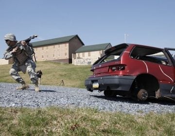 Members of the Pennsylvania National Guard participate in a battle simulation during Exercise Red Rose, Friday, April 2, 2010, at Fort Indiantown Gap in Annville, Pa.  (Carolyn Kaster/AP Photo)