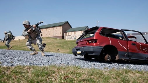 Members of the Pennsylvania National Guard participate in a battle simulation during Exercise Red Rose, Friday, April 2, 2010, at Fort Indiantown Gap in Annville, Pa.  (Carolyn Kaster/AP Photo)