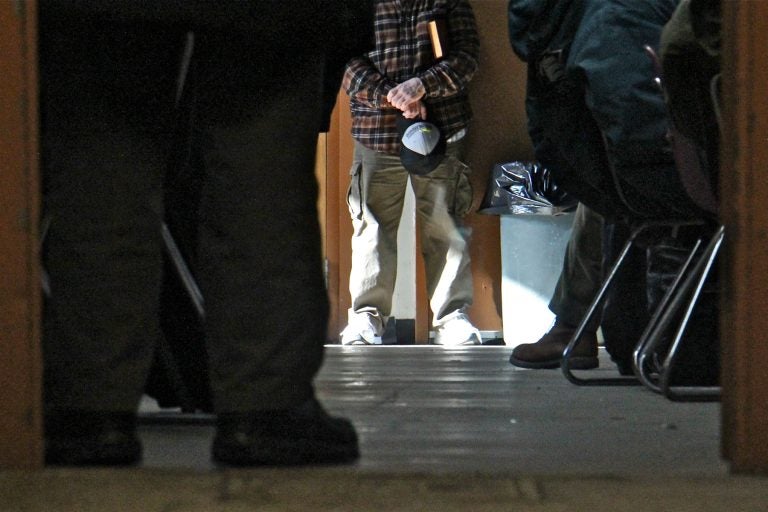 Homeless men crowd into the dining room of the Sunday Breakfast Association, where a prayer service was being held.