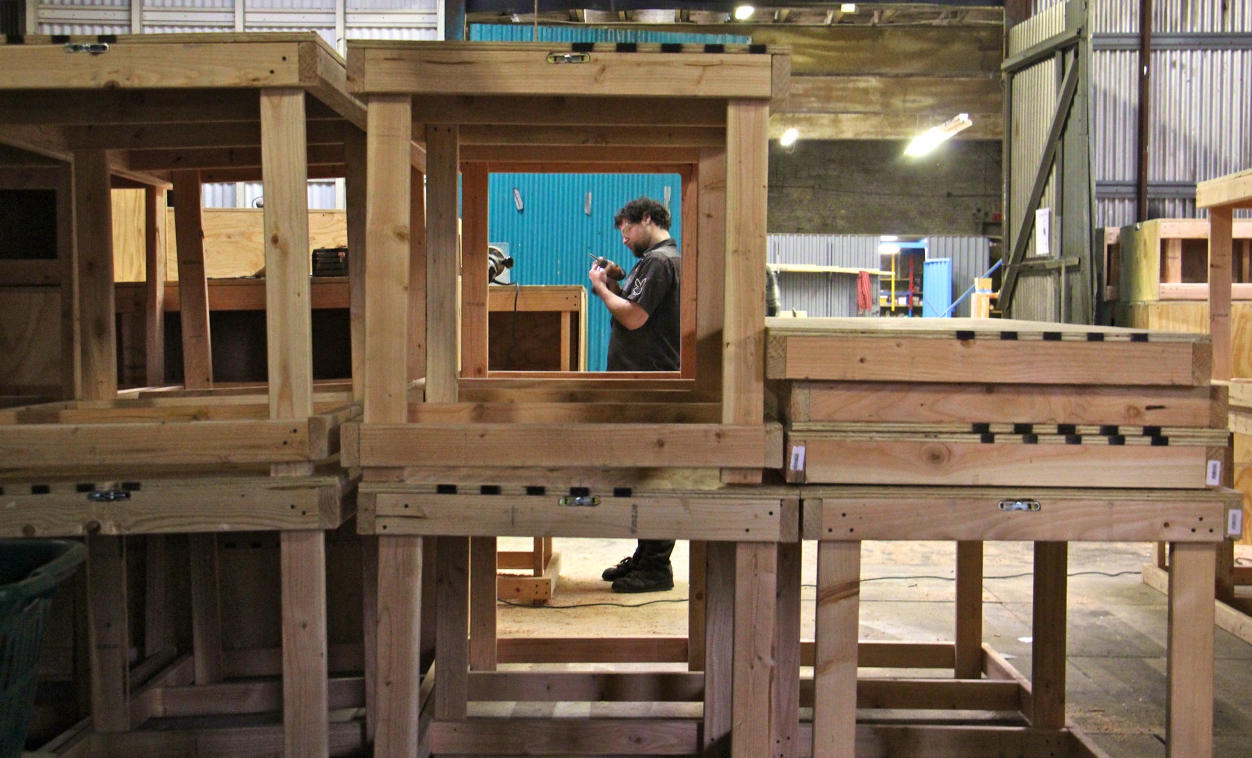 Evan Abrams works on the modular components of the set for EgoPo's production of the "Lydie Breeze Trilogy." The 10,000-square-foot Philadelphia Scenic Works allows small theater companies to tackle big projects. 