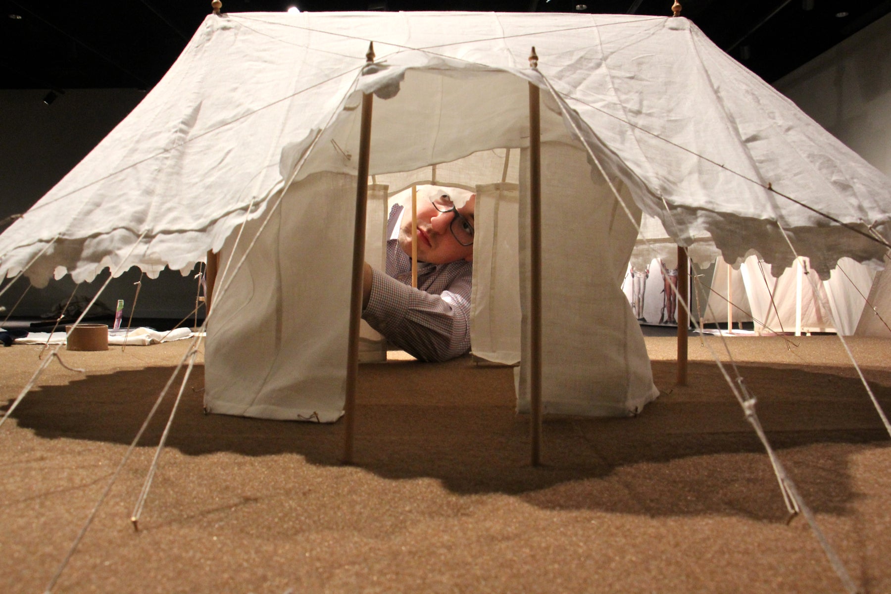 Assistant curator Matthew Skik assembles a miniature replica of George Washington's tent at the Museum of the American Revolution. 