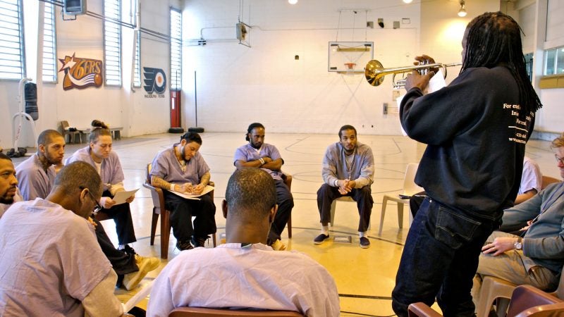 Hannibal Lokumbe plays a trumpet piece for inmates. (Emma Lee/WHYY)