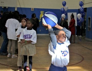 Hartranft fourth-grader Terrsir Smith enjoys a basketball clinic put on by the Philadelphia 76ers at his school, a reward for positive behavior.