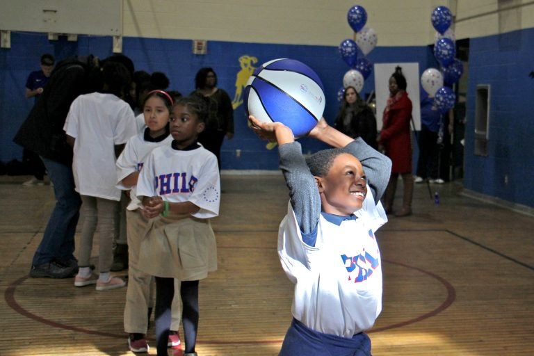 Hartranft fourth-grader Terrsir Smith enjoys a basketball clinic put on by the Philadelphia 76ers at his school, a reward for positive behavior.