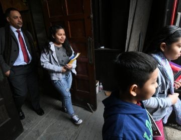 The four undocumented children of Camela Apolonio Hernandez step out of their sanctuary at Church of the Advocate in North Philadelphia, heading back to school for the first time since the family received a deportation order.
