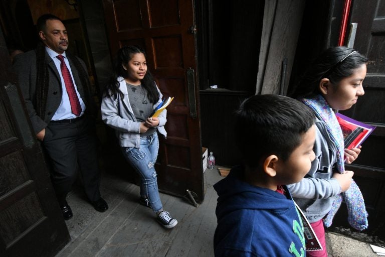 The four undocumented children of Camela Apolonio Hernandez step out of their sanctuary at Church of the Advocate in North Philadelphia, heading back to school for the first time since the family received a deportation order.