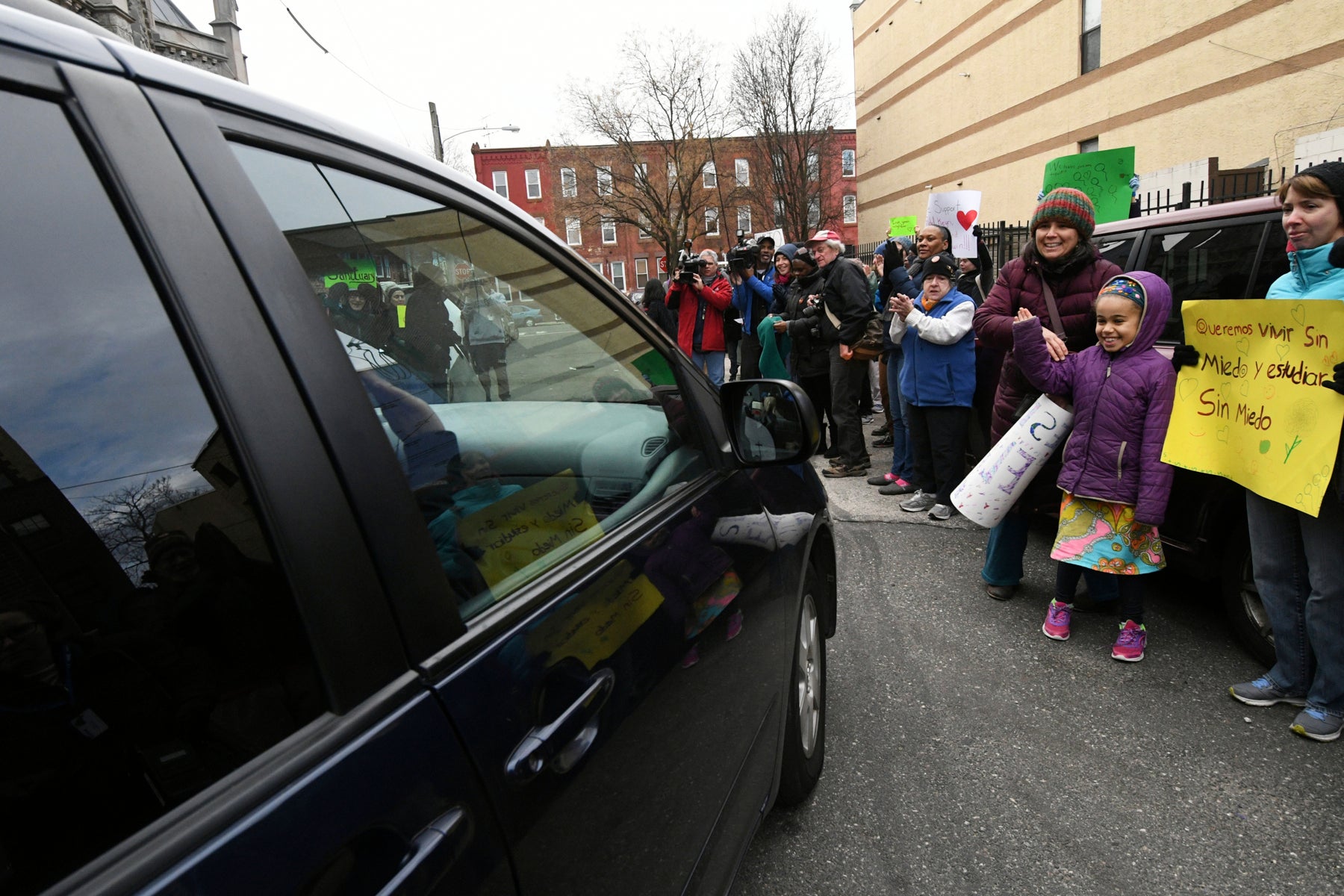 The four undocumented children of Camela Apolonio Hernandez are cheered as they leave sanctuary at Church of the Advocate in North Philadelphia to go to school.