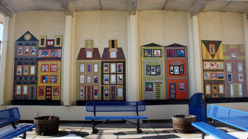 Colorful row houses on the McClure School facade show what the students think might be going on inside.