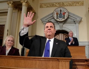 New Jersey Gov. Chris Christie waves to lawmakers before delivering his final state of the state address at the Statehouse in Trenton Tuesday. (Julio Cortez/AP Photo)